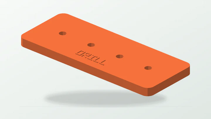 Labelled four-hole drill jig, rendered from its starter dimensions